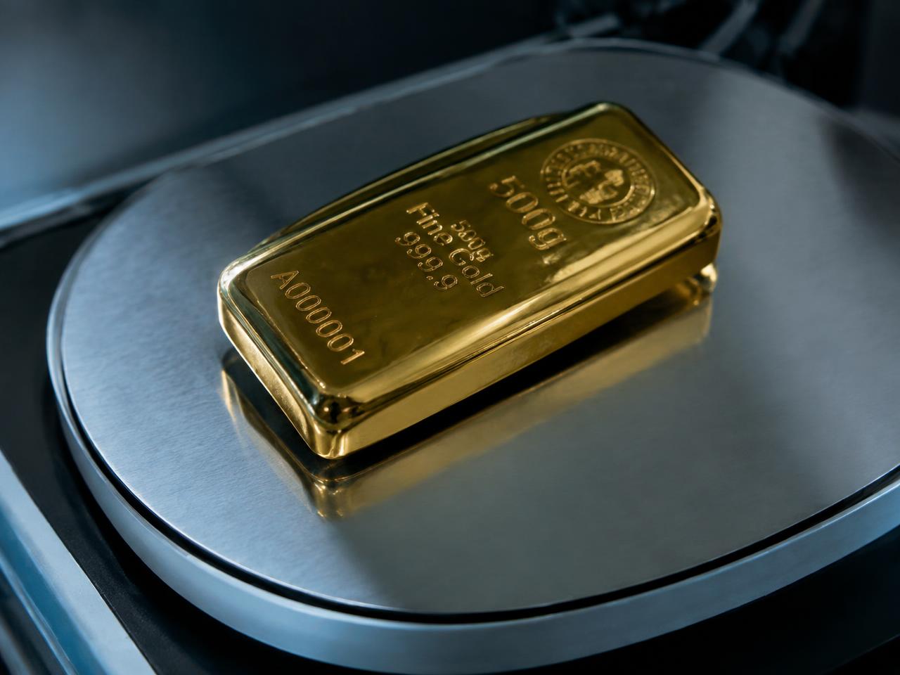 Gold bar on a precision scale in the workshop